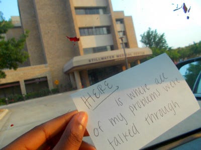 a gallery of photos which contain 17-year-old Ari's hand holding flashcards in front of various locations. each flashcard reads "this is where I..." and is completed with the memory associated with the location