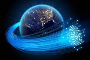 An illustration of optical fibers spinning around the globe.