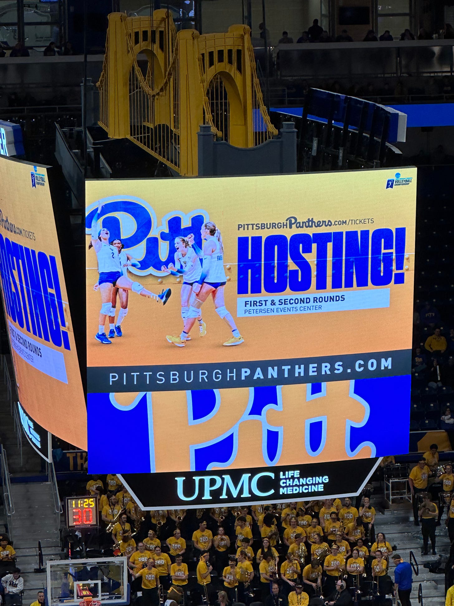 Photo of a scoreboard that says Hosting First & Second Rounds - Petersen Events Center