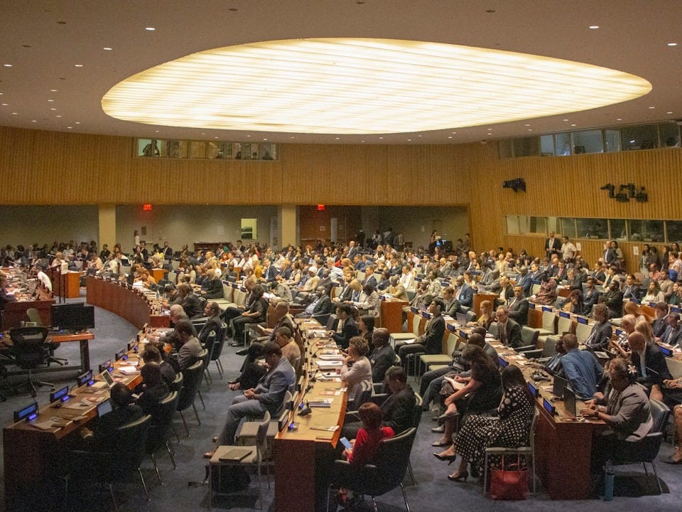 people sitting on chairs inside building
