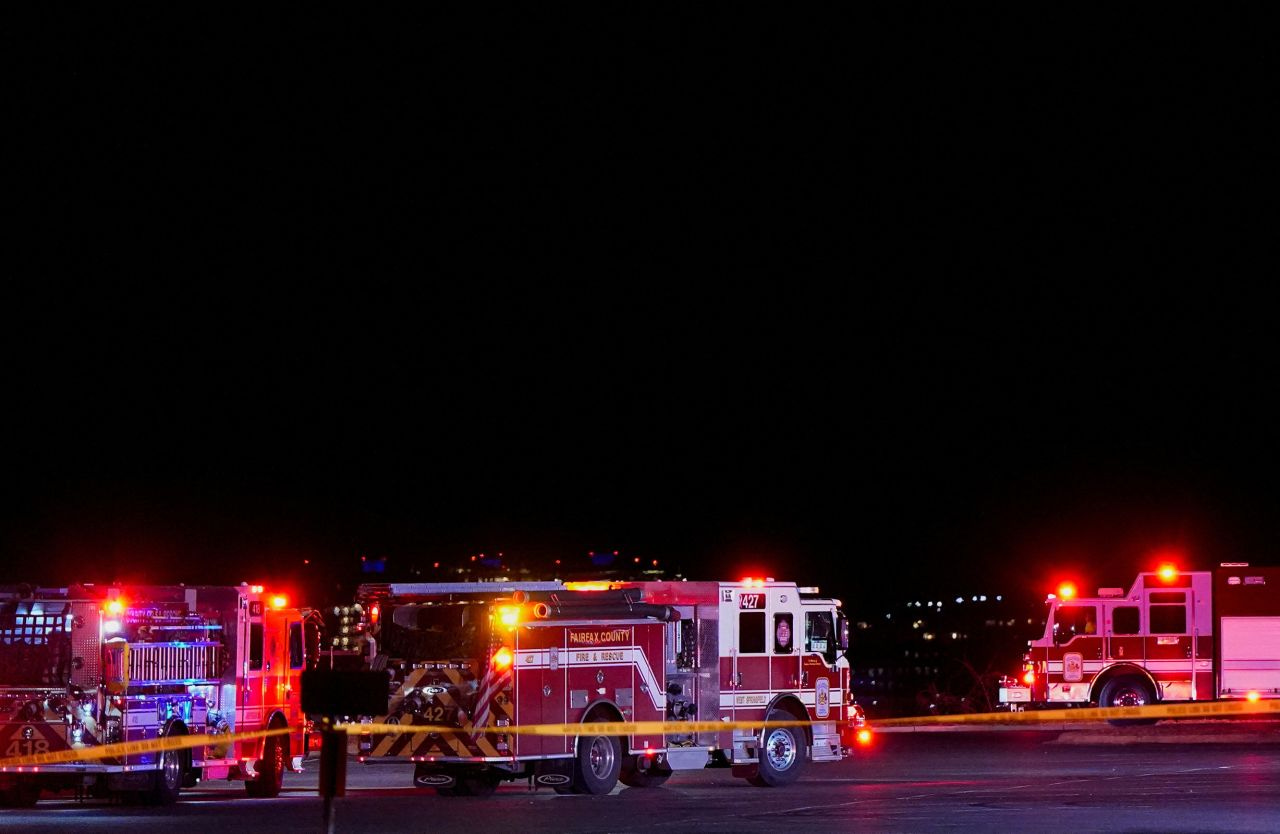 Emergency services operate at Gravelly Point in Arlington, Virginia, after a passenger flight collided with a helicopter on Wednesday. Emergency services operate at Gravelly Point in Arlington, Virginia, after a passenger flight collided with a helicopter on Wednesday.
