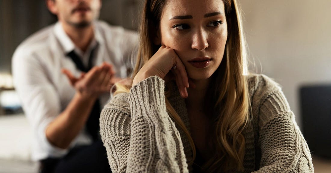 woman feeling cornered by man demanding explanations for lack of sex