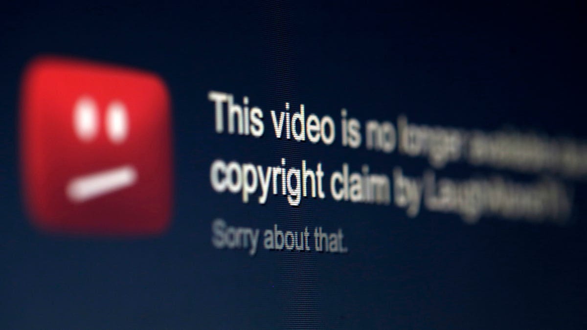 A picture illustration shows a screen with a YouTube copyright message regarding a video.