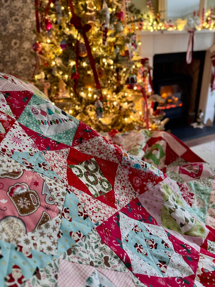 Handmade Christmas quilt in bright, merry fabrics!