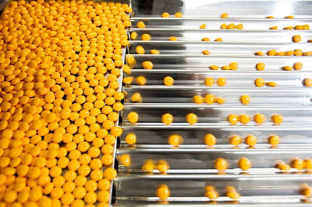 Pills In a Pharmaceutical  Industry Pills in a Pharmaceutical Industry tablet manufacturing stock pictures, royalty-free photos & images