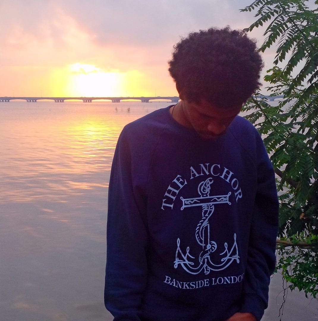 sprenko standing in front of the sea thinking about a world without friends