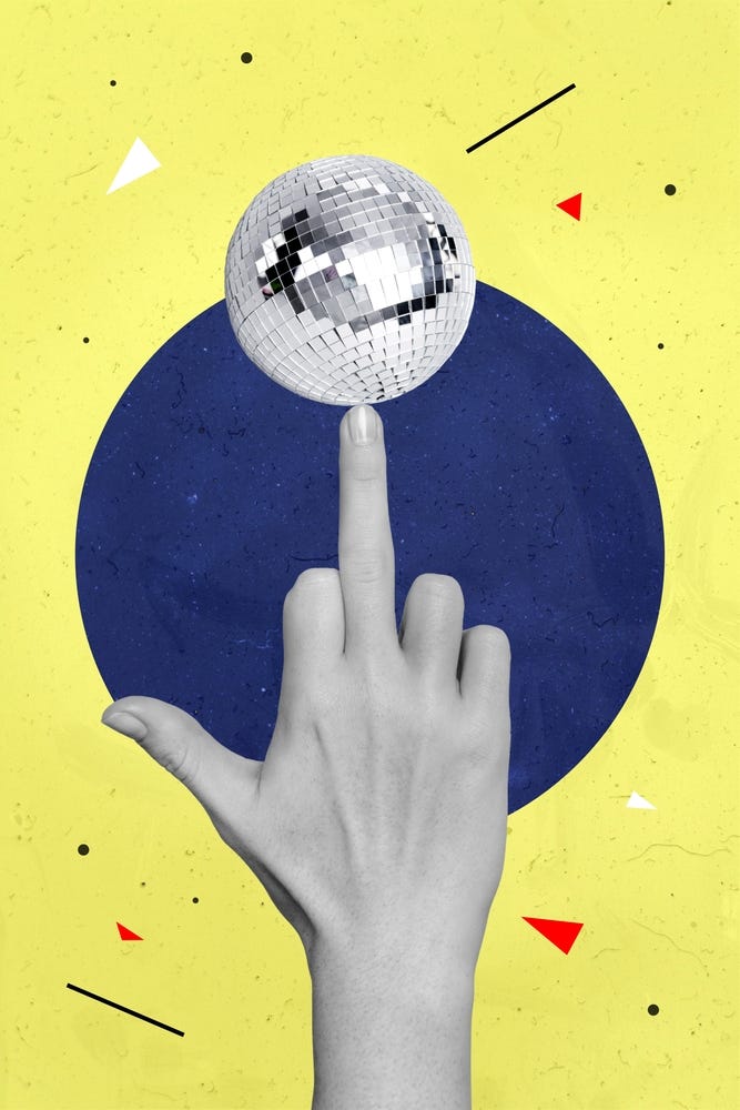 A disco ball spinning on someone's middle finger