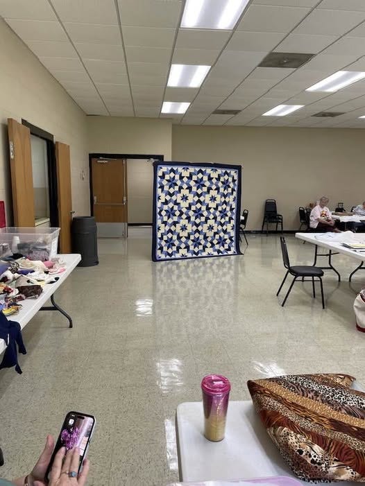 May be an image of 1 person and quilt