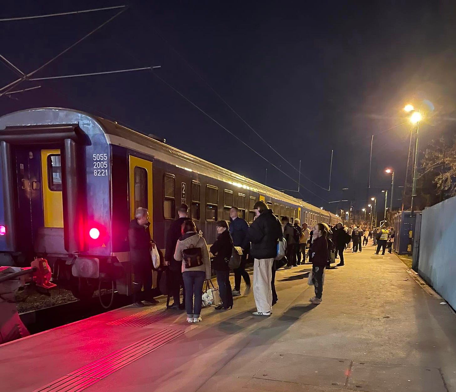 May be an image of train and railroad