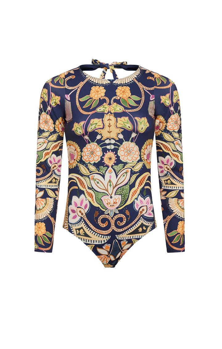 Swim suits with bold prints and one solid orange by Marie Oliver