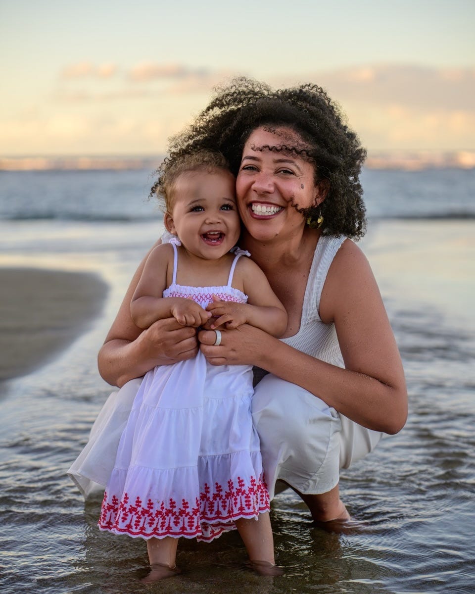 Jessica and two year old daughter Lenny playing on the beach