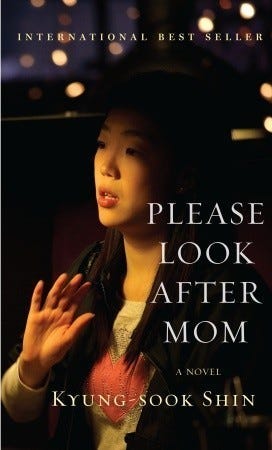 A woman in black. Seems like she is searching for something. The cover image for ‘Please Look After Mom.’