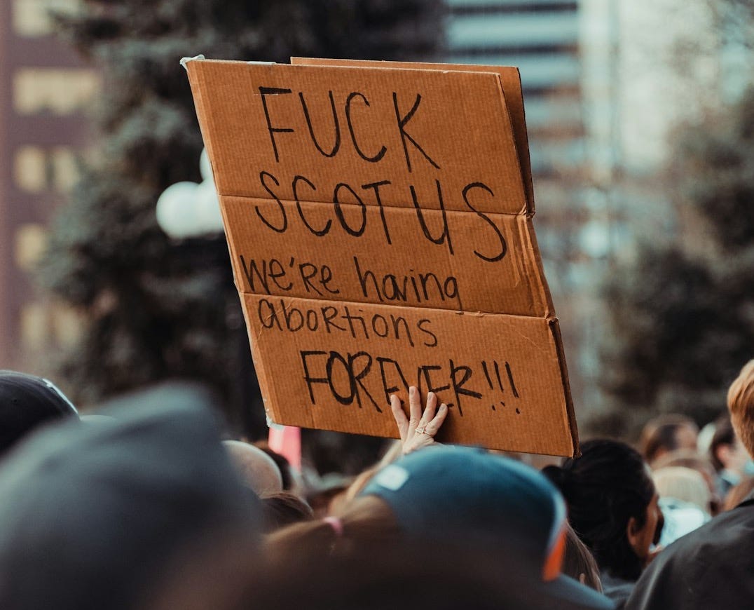 a person holding a sign
