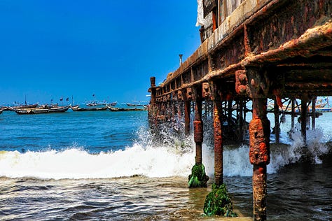 Canoes, boys, girls, pier at James in Accra, Ghana