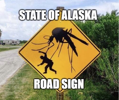 a road sign with a mosquito larger than a man