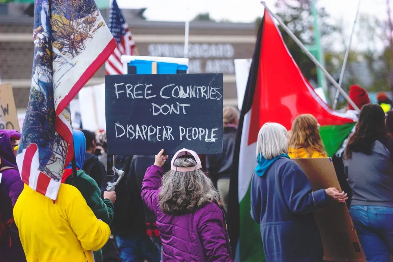 May be an image of crowd and text that says 'FREE لا DONT DISAPPEAR PEDPLE' May be an image of crowd and text that says 'FREE لا DONT DISAPPEAR PEDPLE'