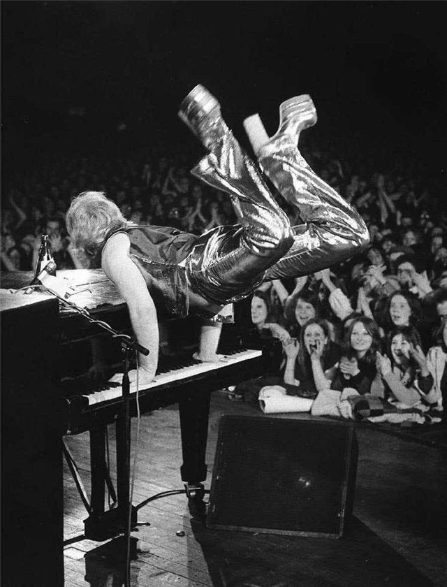 A Pinterest pin added by andysly on Apr 15, 2025. The author is @lozziibailey. May present: elton john piano jump, elton john, piano, ed caraeff.