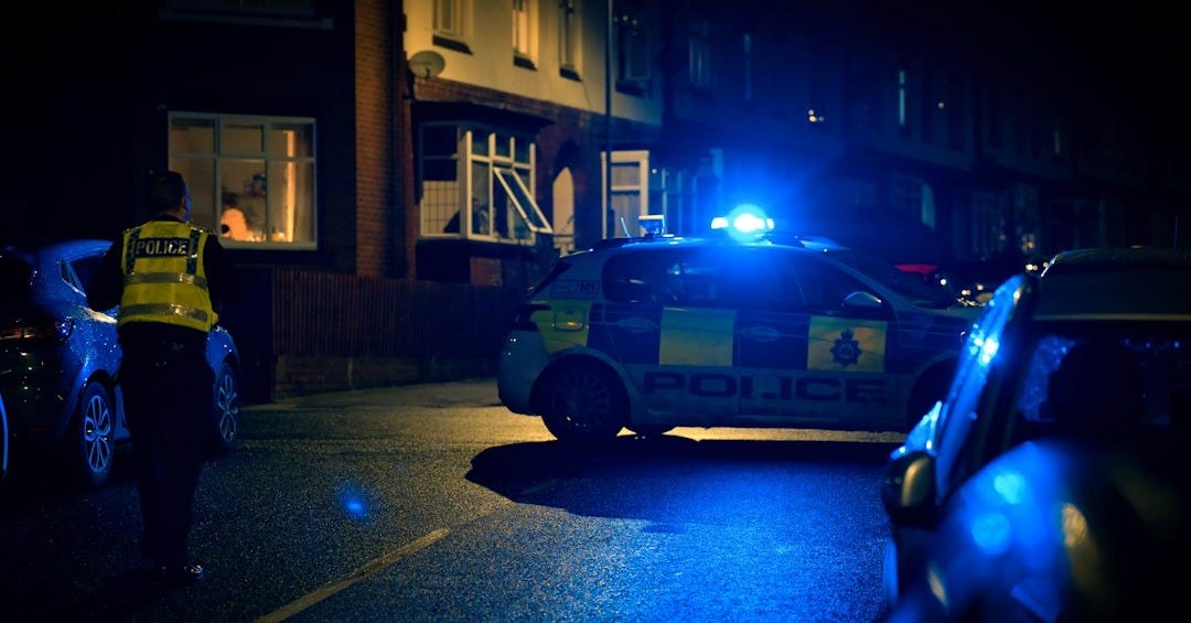 a police car parked on the side of the road a police car parked on the side of the road