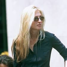 Carolyn Bessette Kennedy showing her street style in the 90s with cool-girl hair and pared back makeup The Beauty Ed®