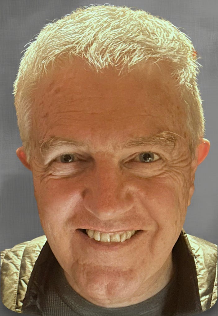 Head shot photo of Ric Bayly, smiling.