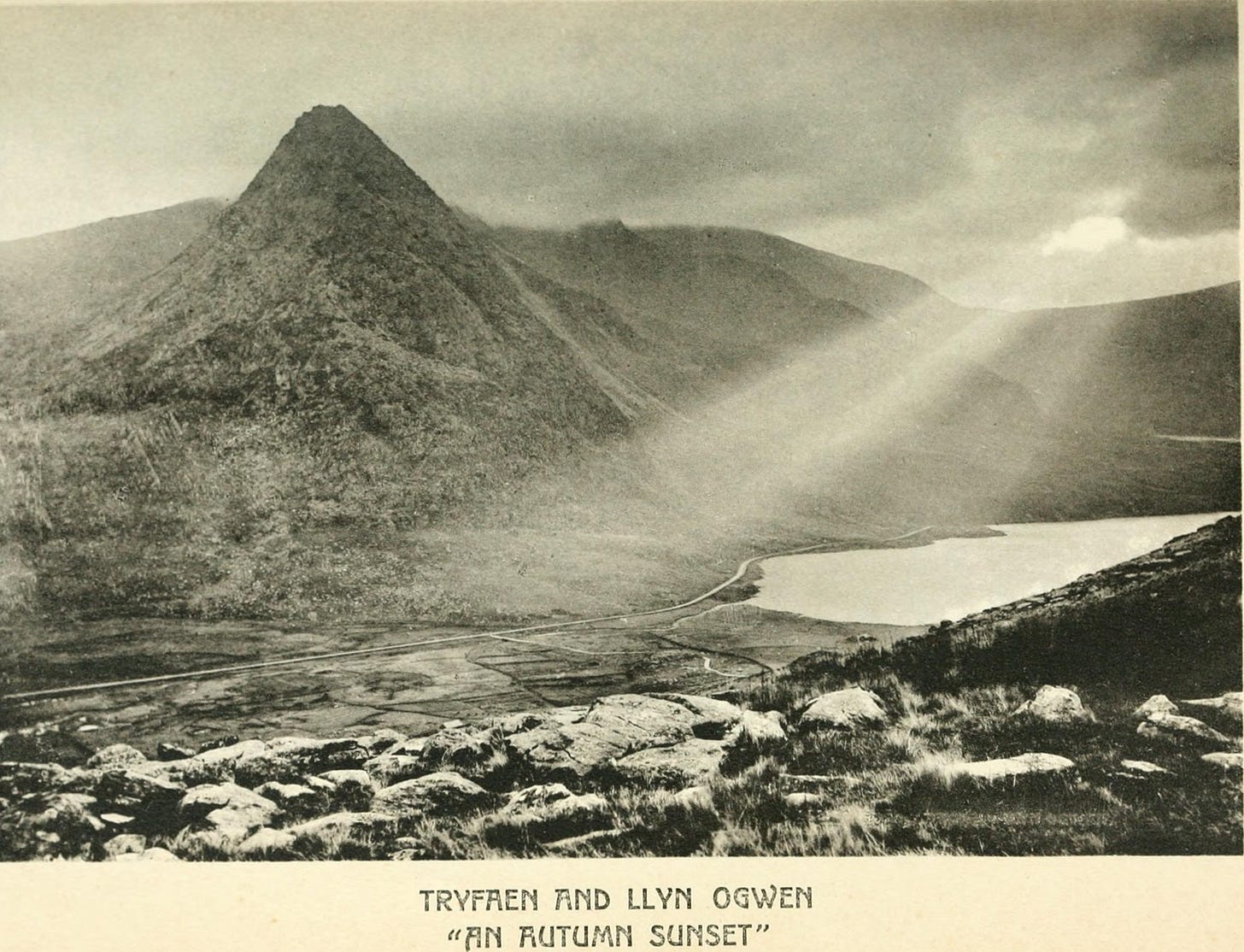 pointy mountain, lake, cloudy evening 'an autumn sunset'