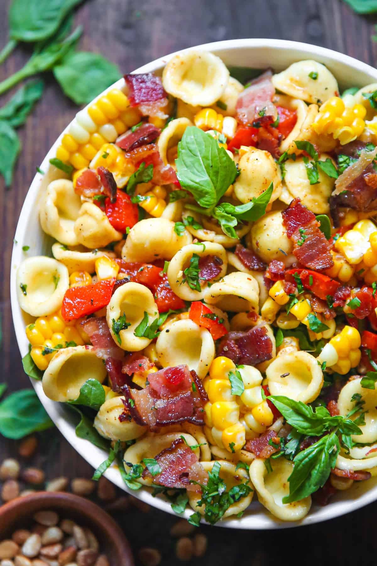 Corn Pasta Salad with Bacon and Creamy Pesto Dressing in a bowl Corn Pasta Salad with Bacon and Creamy Pesto Dressing in a bowl