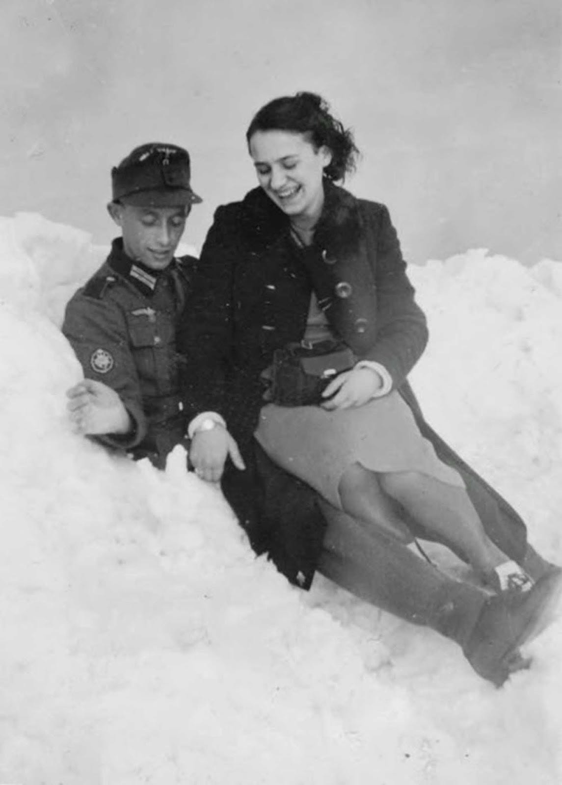A friendly encounter in a snowdrift: A Wehrmacht Gebirgsjäger private and a woman, notably wearing nylons, a highly prized and fashionable item during the 1940s. A friendly encounter in a snowdrift: A Wehrmacht Gebirgsjäger private and a woman, notably wearing nylons, a highly prized and fashionable item during the 1940s.