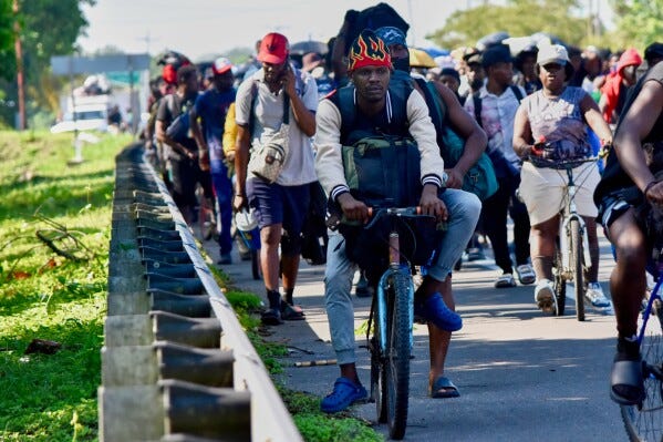 Migrants walk on the highway through the municipality of Huehuetan, Chiapas state, Mexico, Tuesday, April 21, 2026, after leaving Tapachula the previous night. (AP Photo/Edgar H. Clemente) Migrants walk on the highway through the municipality of Huehuetan, Chiapas state, Mexico, Tuesday, April 21, 2026, after leaving Tapachula the previous night. (AP Photo/Edgar H. Clemente)
