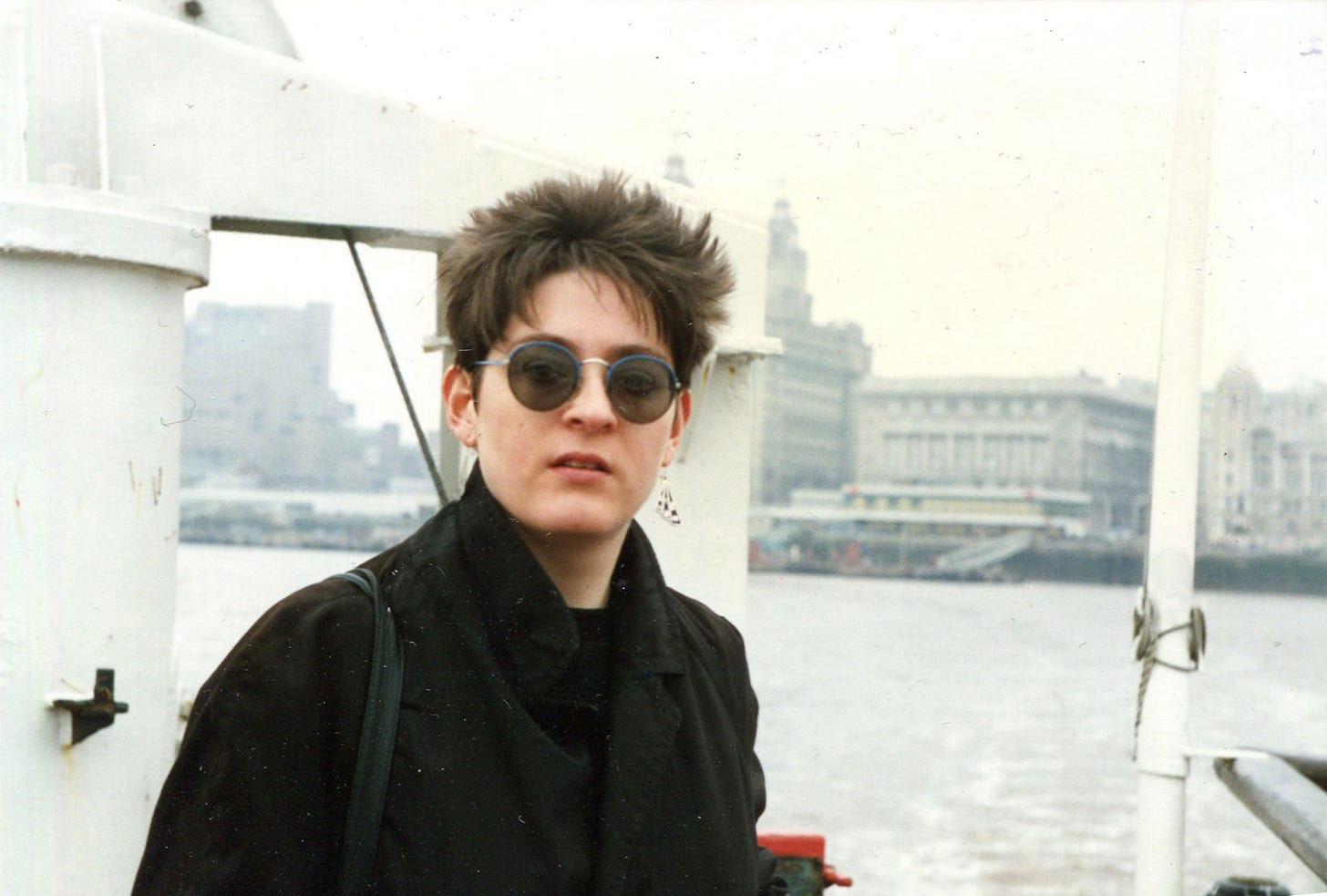 Young woman with spiky hair and shades (that's me!) on the Mersey ferry.