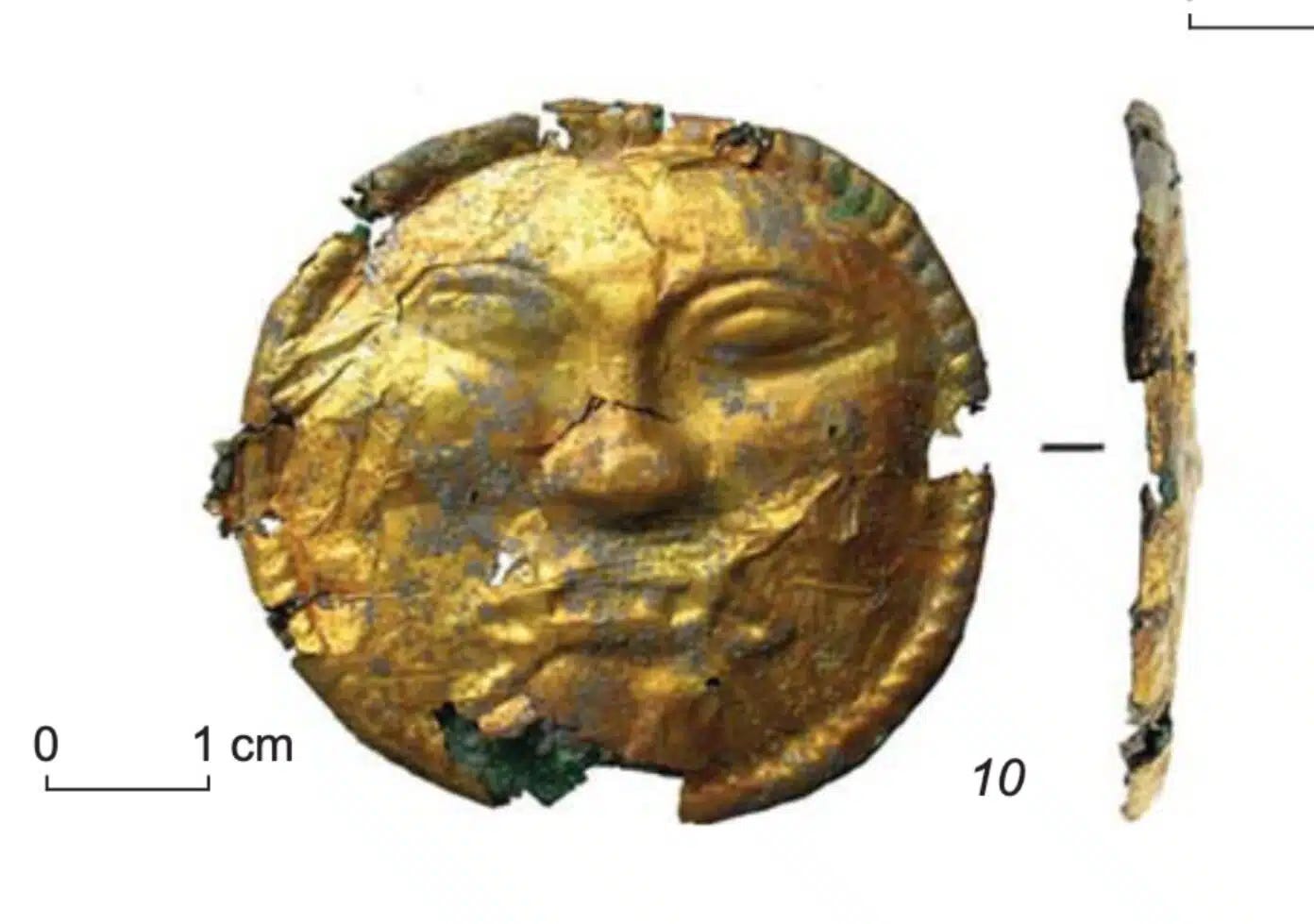 The gold forehead ornament from Burial 11 at Karakabak, with a face resembling a Greek gorgoneion. Front and profile views.