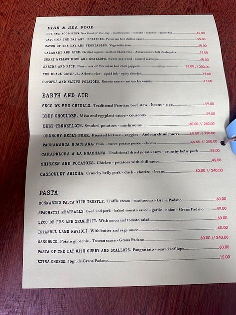 The pages of Awicha's menu including appetizers, duck dishes, mains, and an extensive beverage menu.