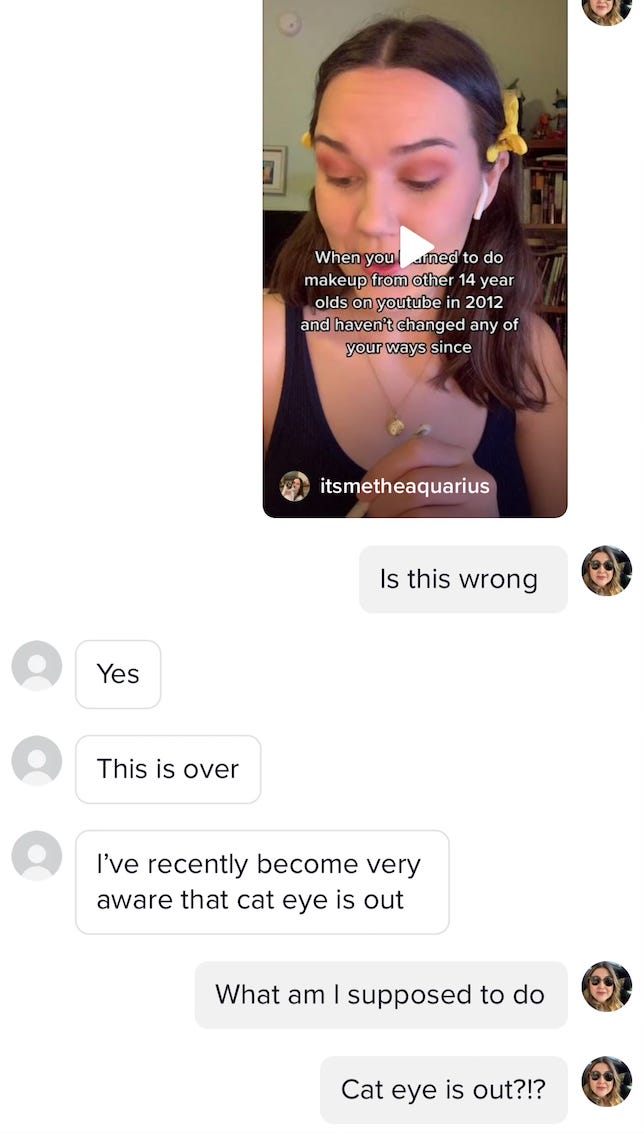 Two friends talk in the chat portion of TikTok about how makeup trends from 2012 are out. Cat eye is also out!