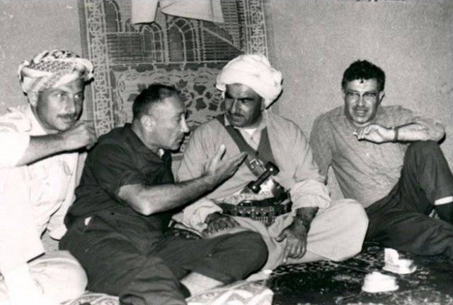 The head of Israel’s Mossad, General Meir Amit, in dark clothing, met with the Kurdish leader Mulla Mustafa Barzani in the Kurdistan mountains (circa 1966). The men on their sides are Mossad representatives.