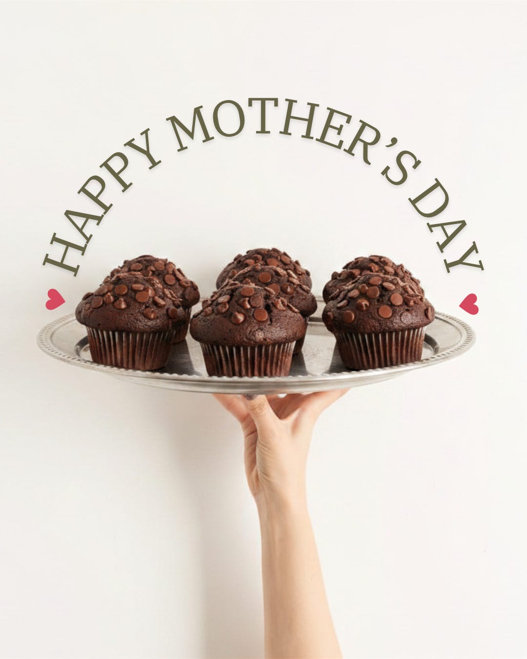 A Happy Mother's Day sign over a plate of chocolate chocolate chip muffins
