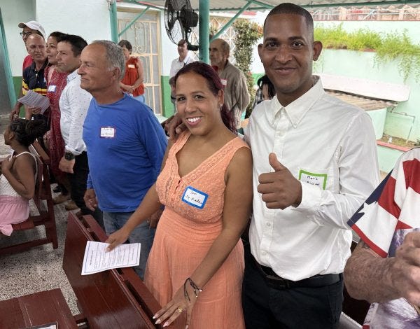 Mario and Yani Suárez stand during worship at the Missionary Congress event in Matanzas, Cuba.