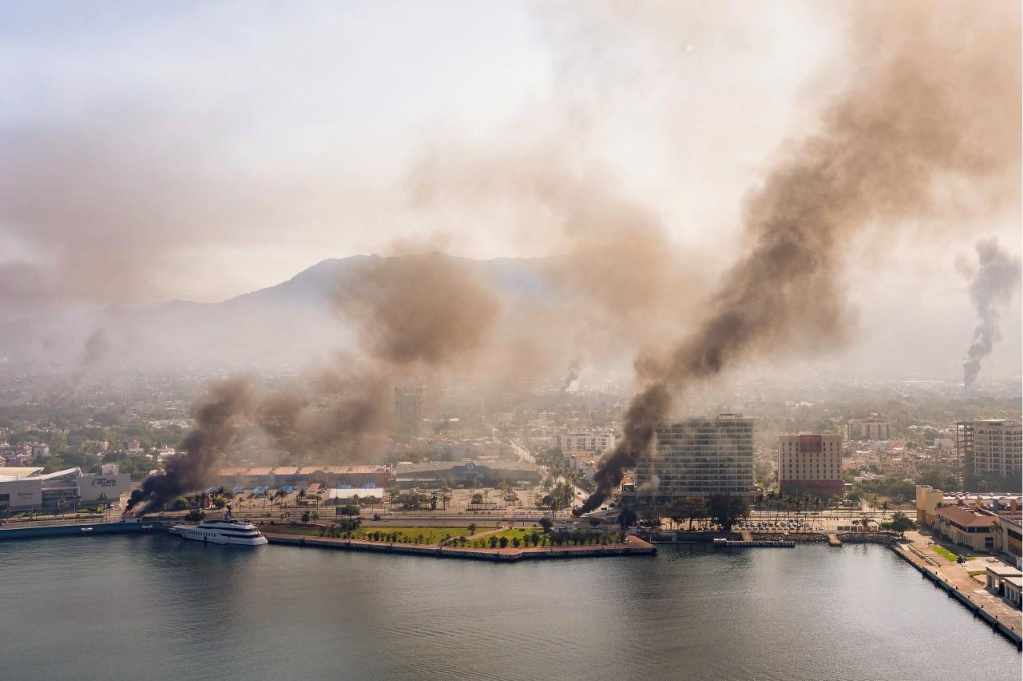 Aerial view of plumes of smoke rising from multiple locations in Puerto Vallarta, Mexico.