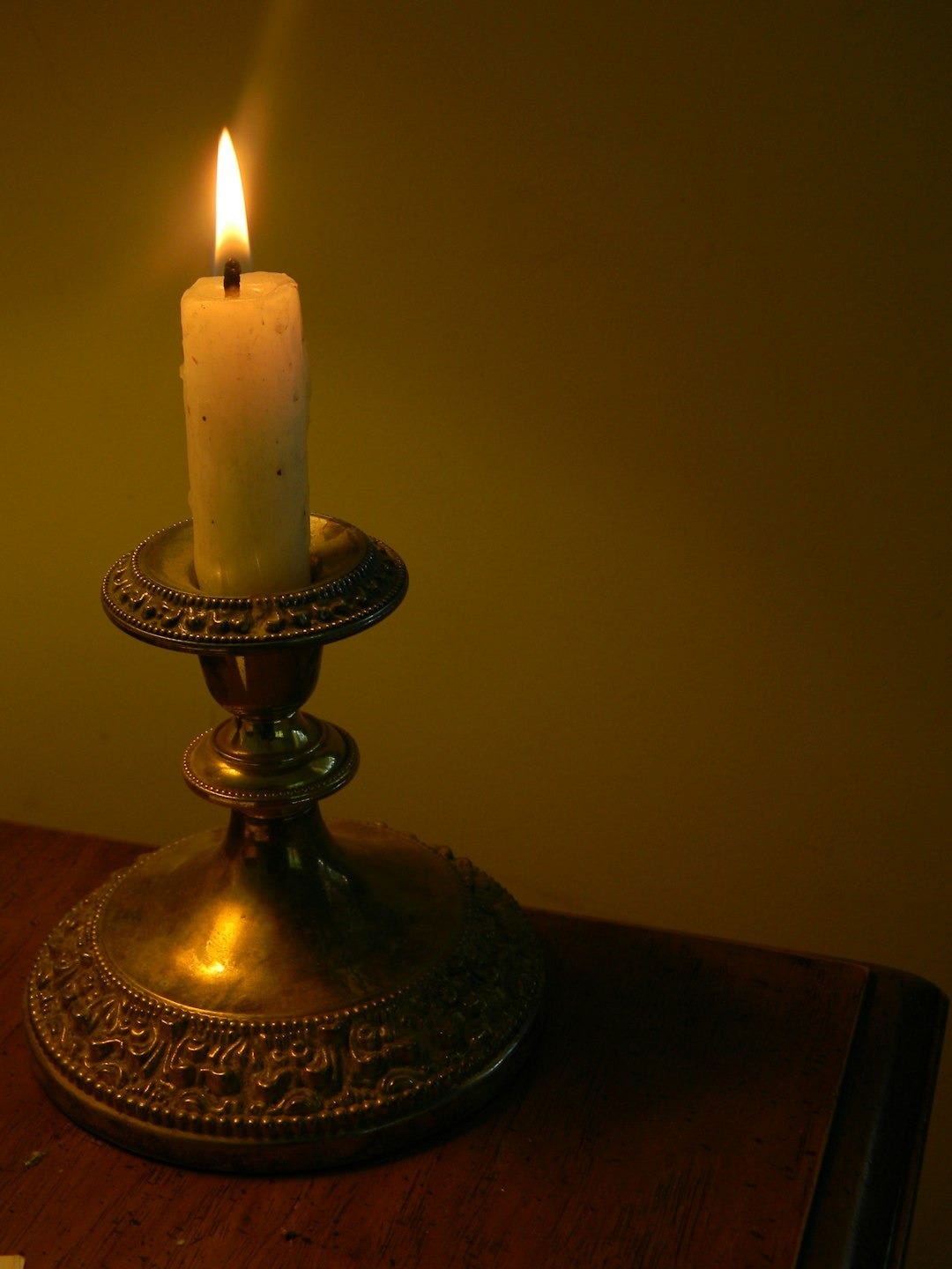 a candle on a stand