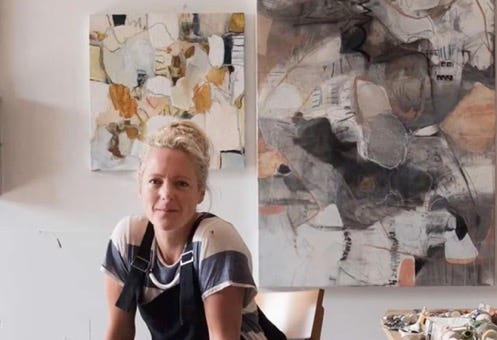 A person sitting in front of a painting

Description automatically generated with medium confidence