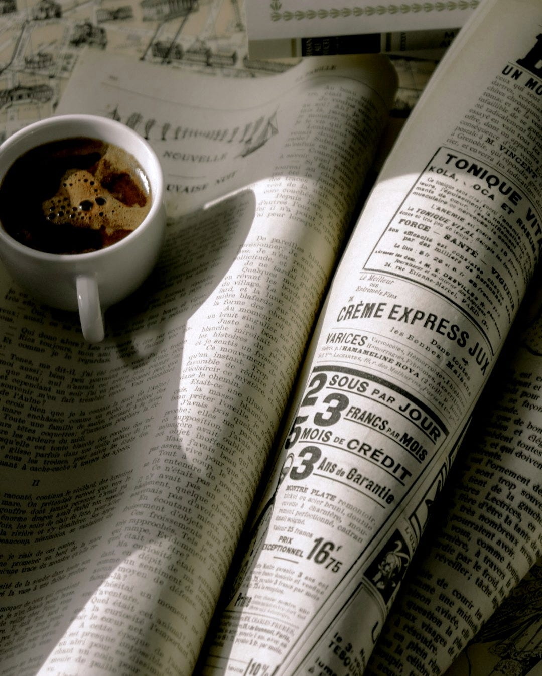 a cup of coffee and a newspaper a cup of coffee and a newspaper