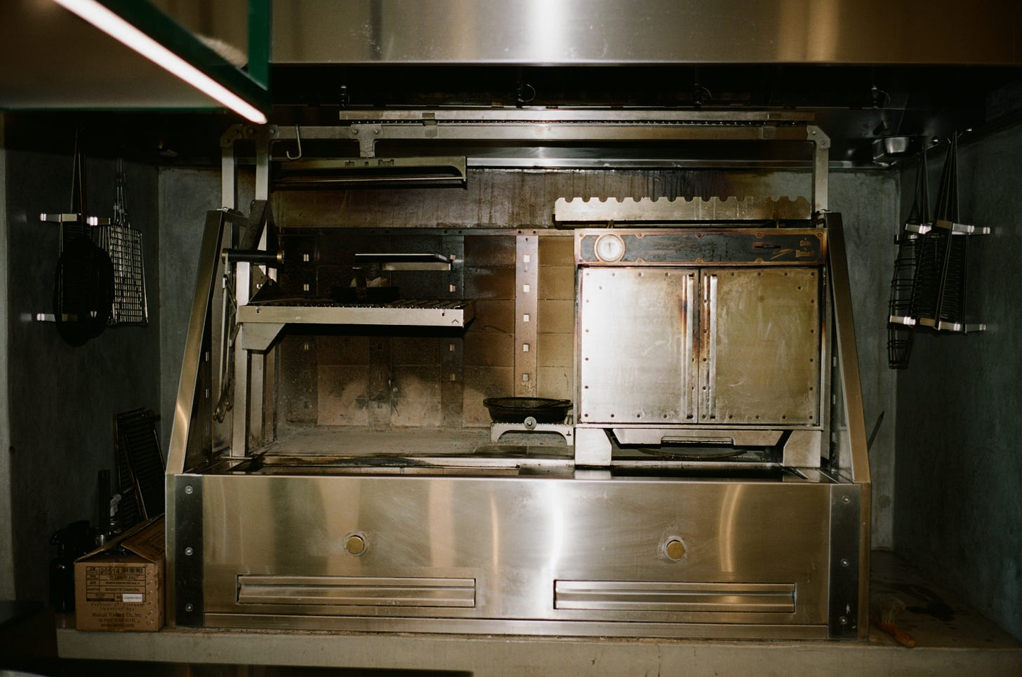 Tomat's custom wood-fire grill