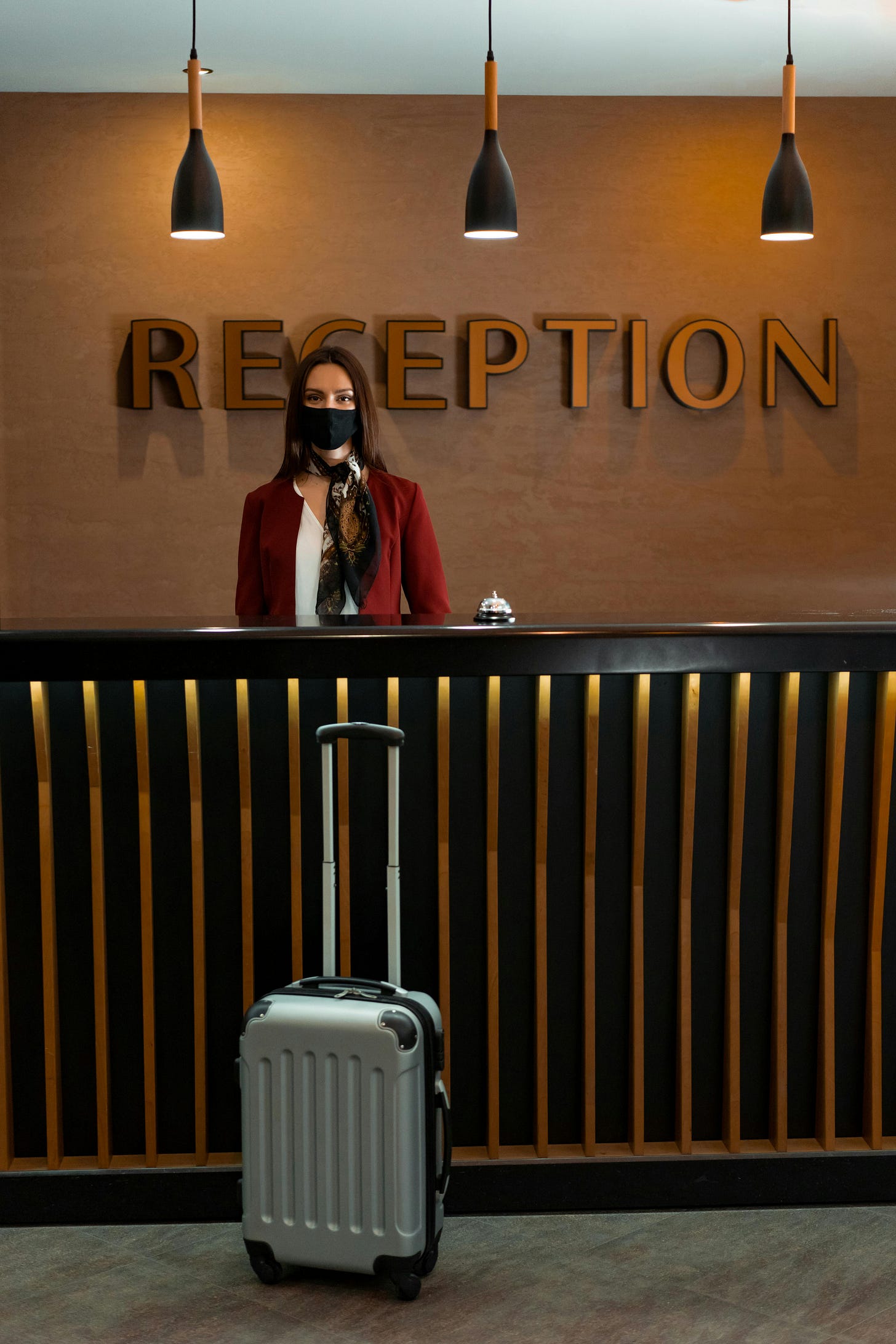 A Woman in a Face Mask at a Reception Desk · Free Stock Photo A Woman in a Face Mask at a Reception Desk · Free Stock Photo