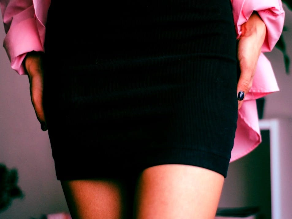 a close up of a person wearing a skirt
