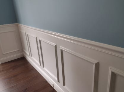 Straight edge painting on wainscotting. Straight edge painting on wainscotting.