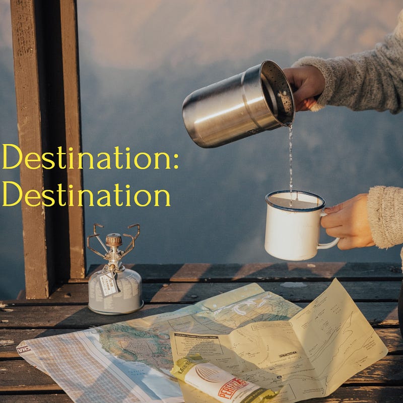 Someone pouring water into a mug held over some maps.