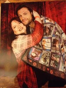Jared and @thebounds pose with the quilt - photo used with permission Jared and @thebounds pose with the quilt - photo used with permission