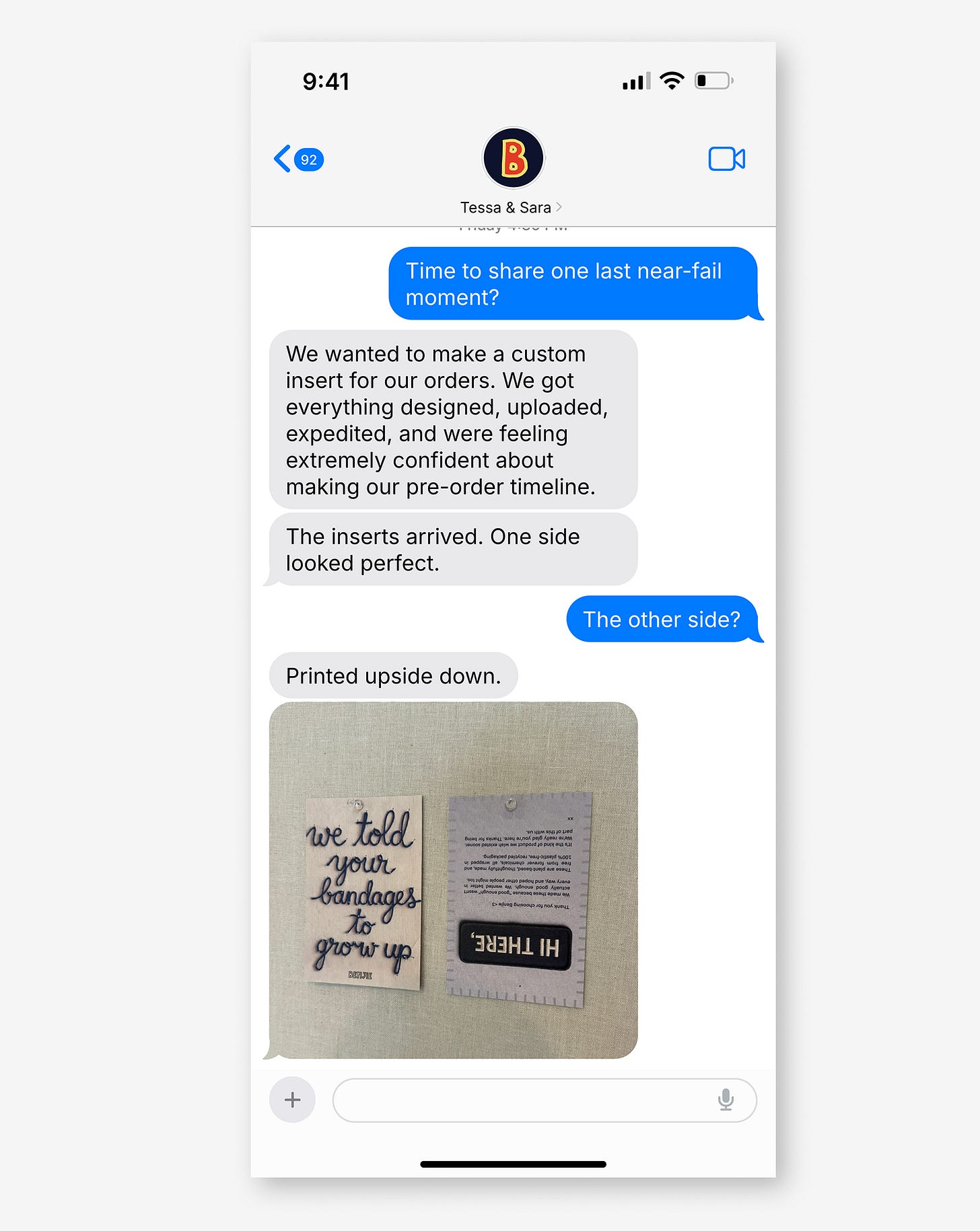 iPhone text conversation with Benjie founders describing a custom order insert that arrived with one side printed upside down.