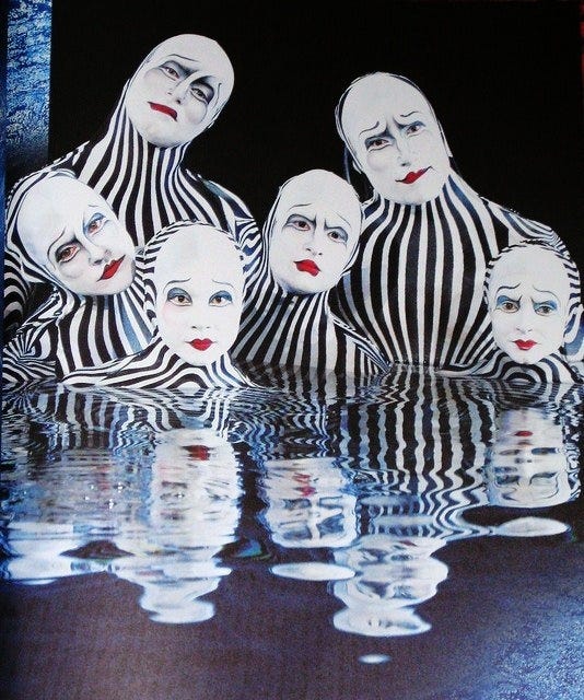 This may contain: an image of some people in striped outfits with their faces painted like clowns on them