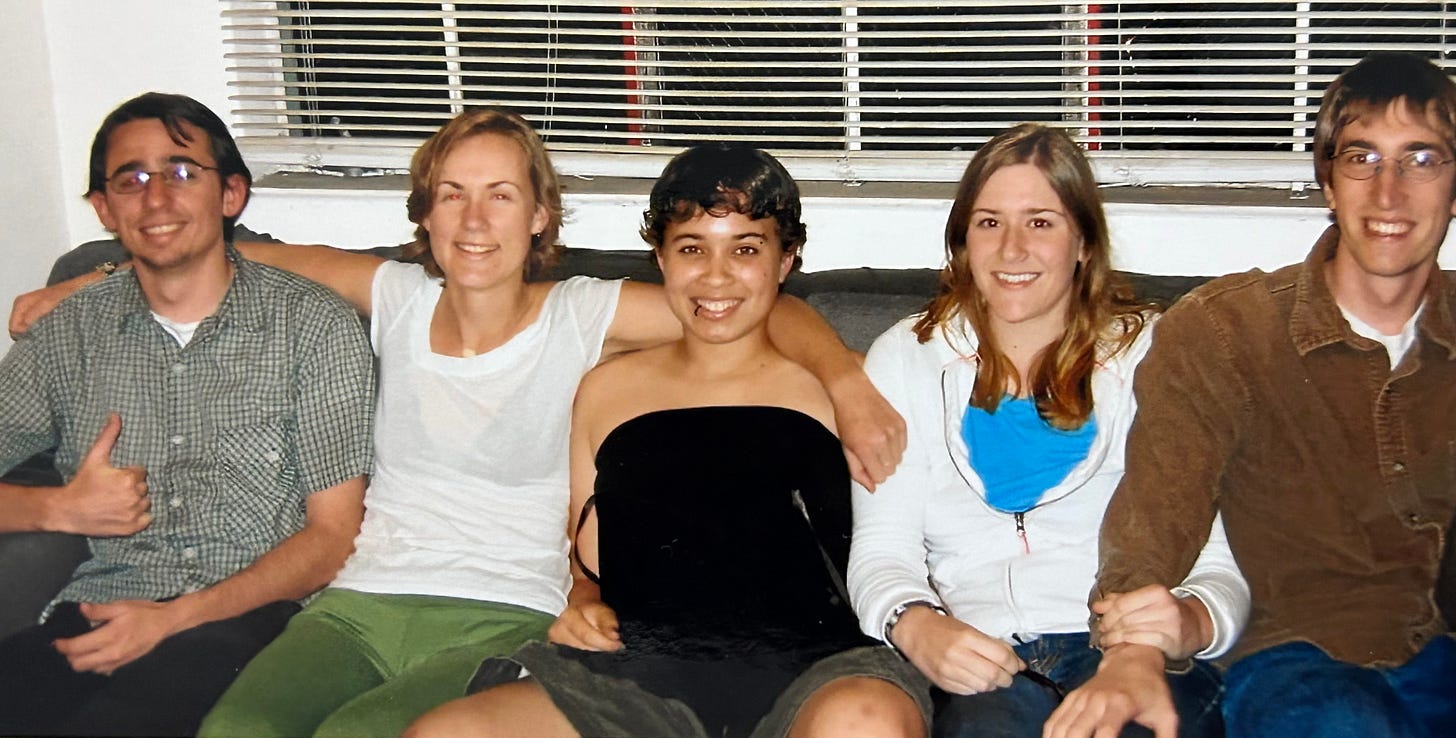 5 college students sitting on a couch