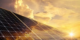 Photo of solar panels at sunrise or sunset