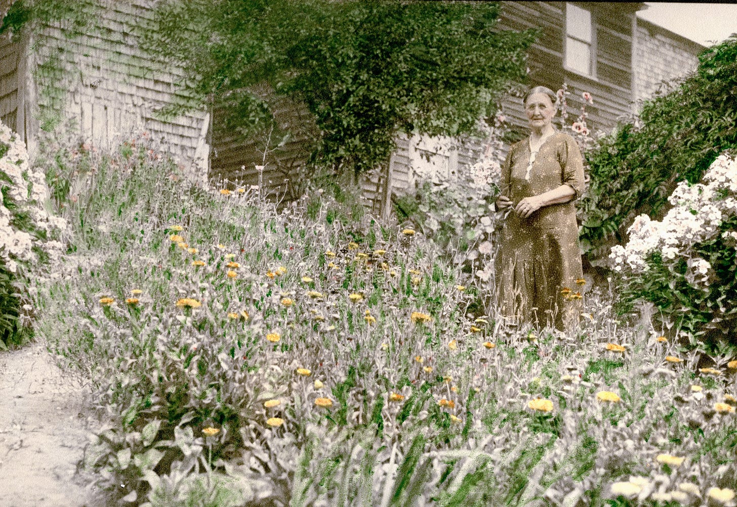 Woman standing in a flower garden